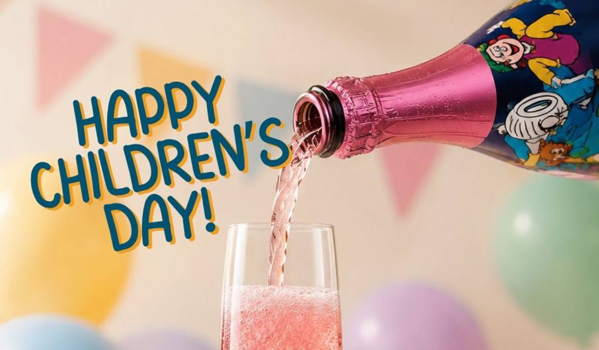 Happy Children's Day celebration with a sparkling pink soft drink being poured into a champagne glass
